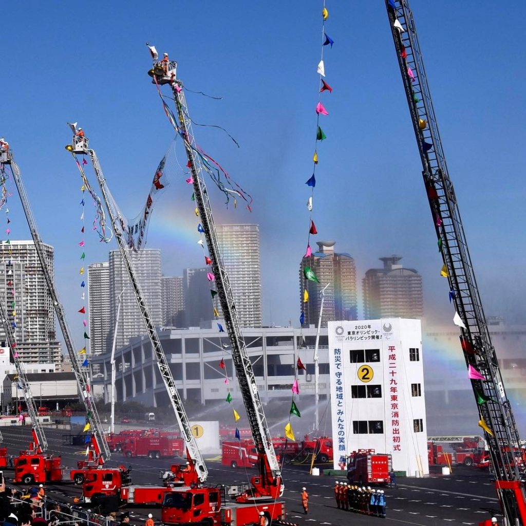 @The Japan Times: A man-made rainbow provides a colorful backdrop for the Tokyo Fire Department’s …