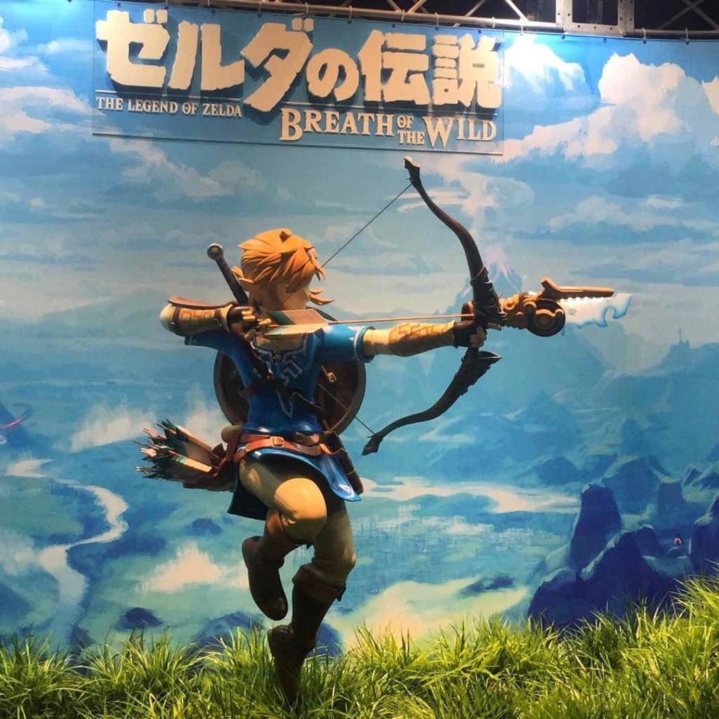 @The Japan Times: “Listen!” — A statue of Link at a booth for “The Legend of Zelda: Breath of the …