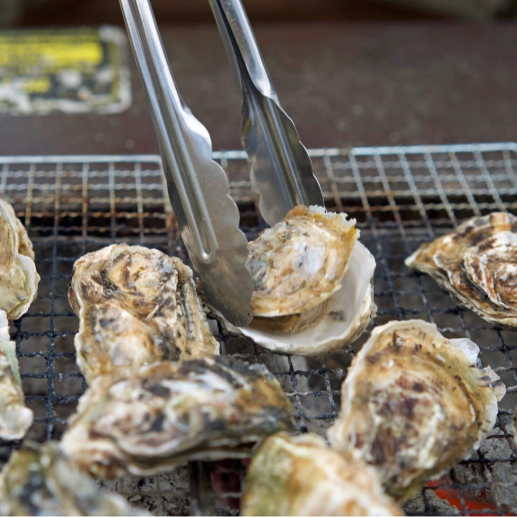 @The Japan Times: The air in a “kakigoya” (oyster hut) is smoky, strong with the smell of seafood….