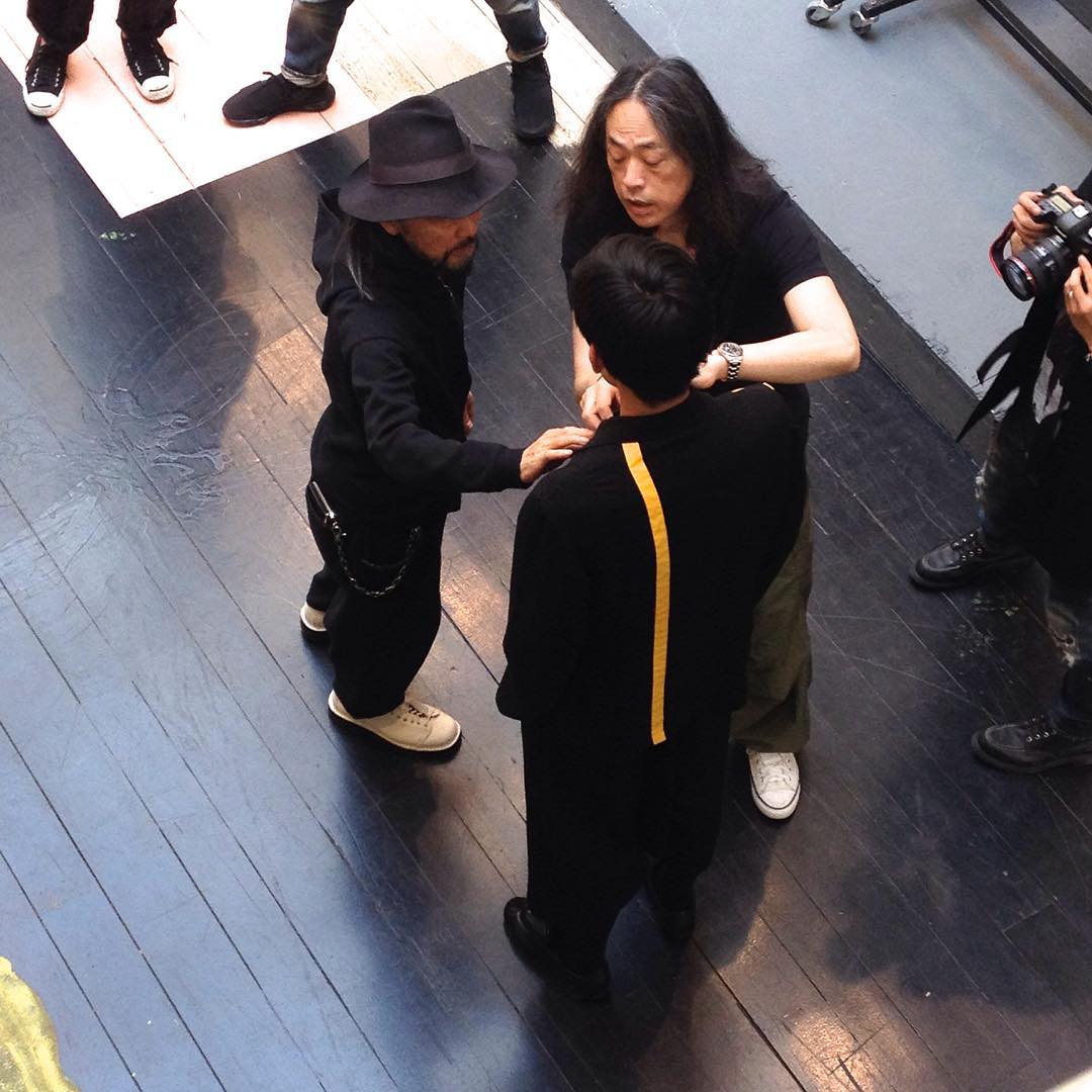 @Yohji Yamamoto: Yohji adjusting the look just before the show. # ...