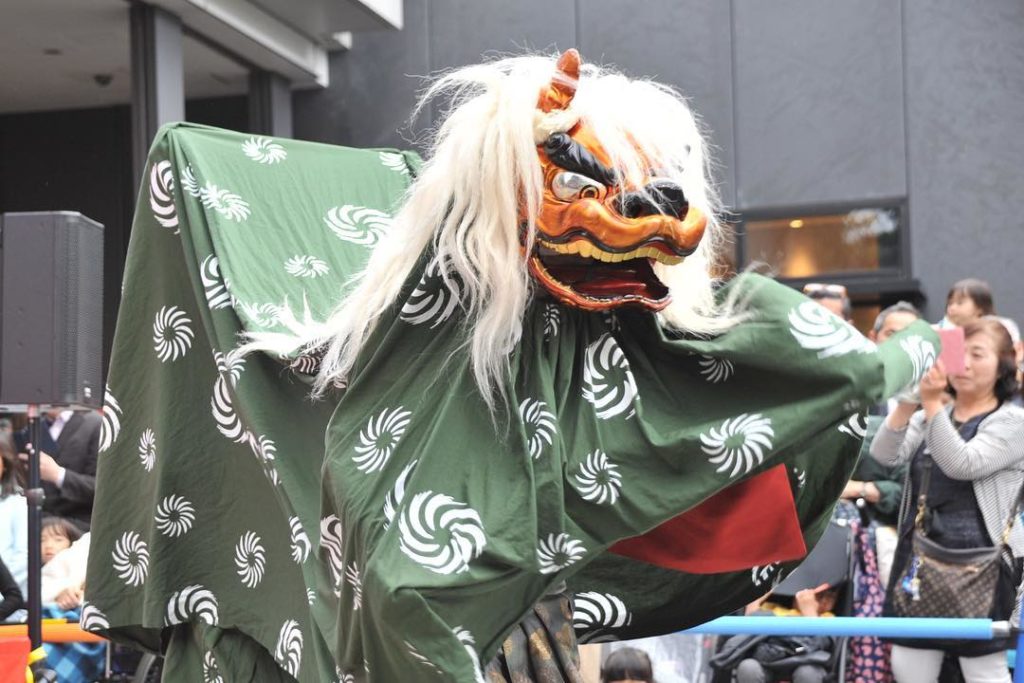 A shishimai lion dance is performed by Edo-Daikagura Maruichi Senoh troupe in fr...