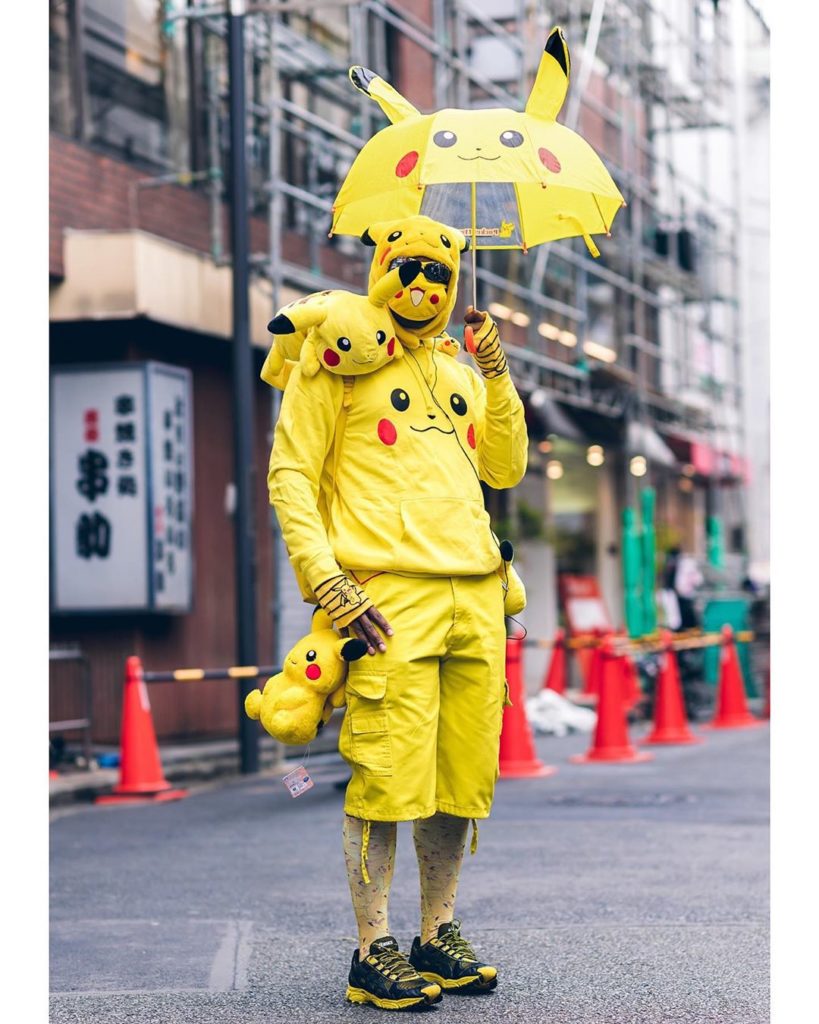 J. on the street in Harajuku wearing a Pikachu inspired street style featuring a...