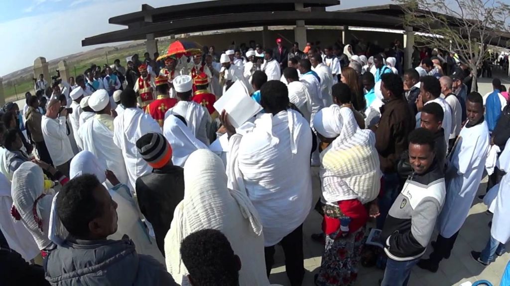 Religious singing of the Eritrean community - Epiphany at the baptismal site. Jordan River, Israel