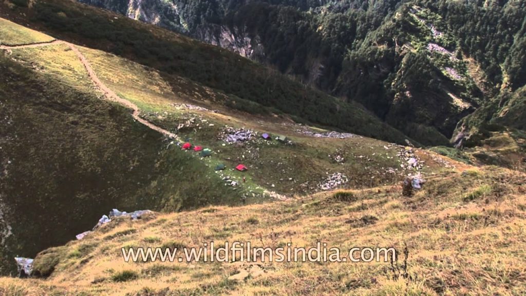 Sunlight plays hide and seek over a campsite enroute to Baraadsar Lake