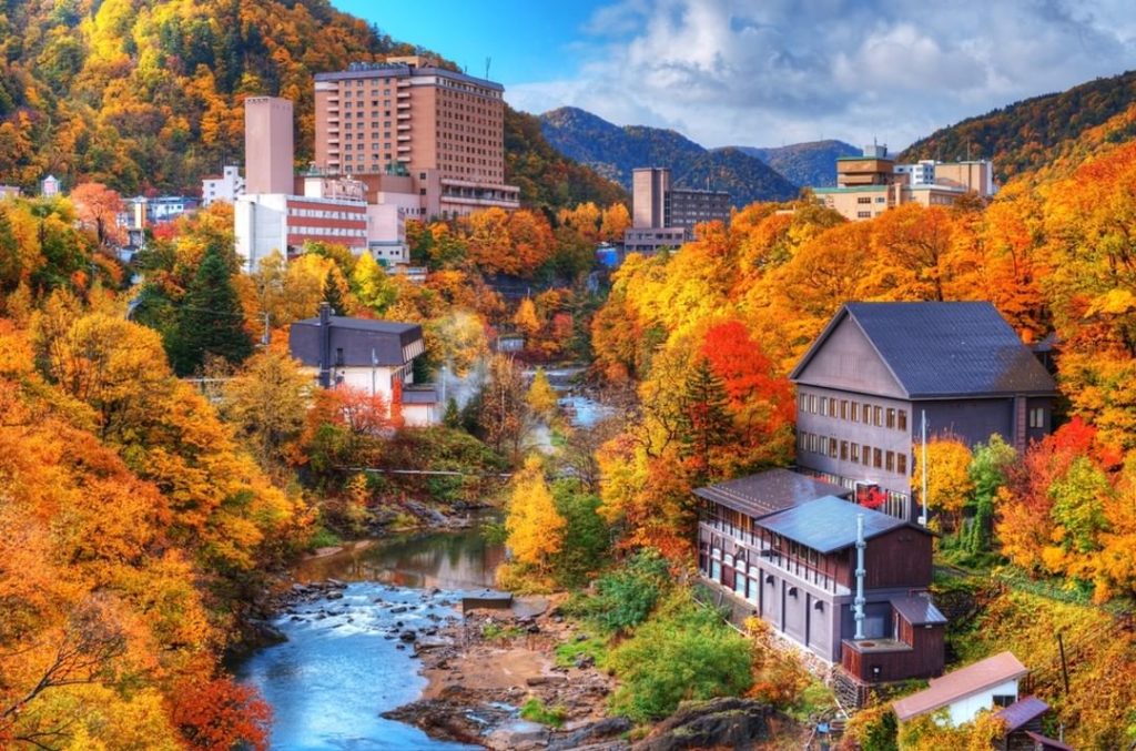 Soaking in hot springs while gazing at fall leaves is perhaps one of the most re...