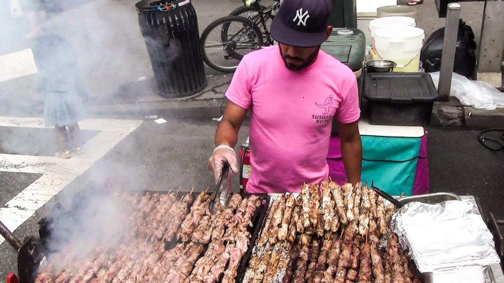 New York Street Food. Many Huge Grills in Manhattan Streets