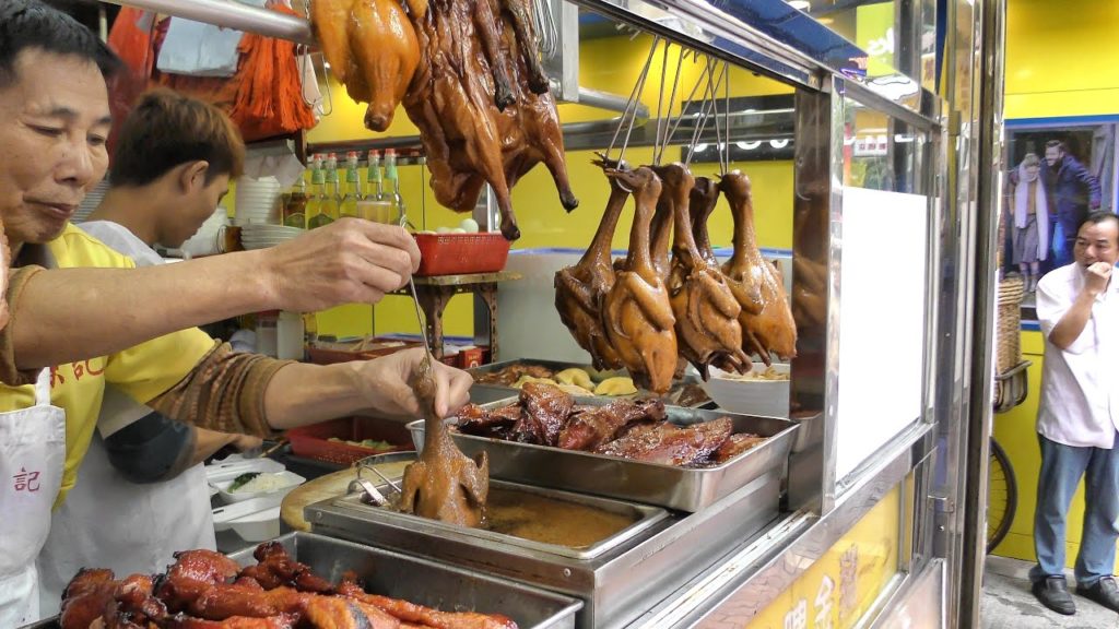 Hong Kong Street Food. The Roasted Bird Dipped in Sauce