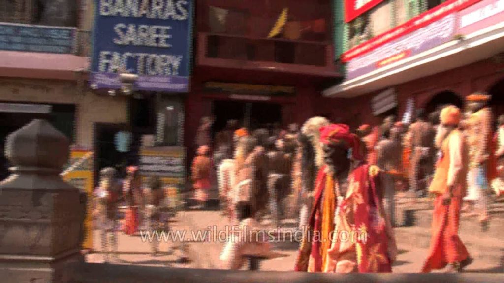 Naked Hindu holy men rallying towards Ganga Ghat in Varanasi for Maha Shivratri