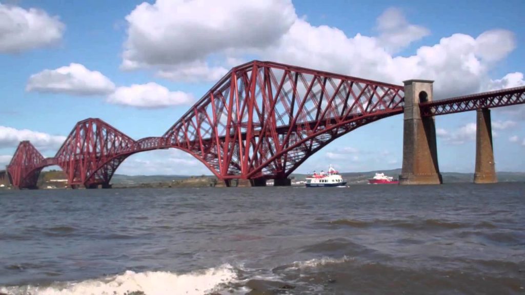 Boat Returning To South Queensferry By The Forth Railway Bridge Scotland