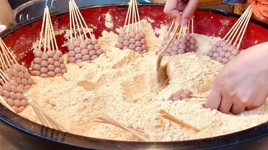 Japan Street Food – Kinako Dango (黄粉) sweet roasted soy flour dumplings and Matcha (抹茶) green tea Japan Street Food - Kinako Dango (黄粉) sweet roasted soy flour dumplings and Matcha (抹茶) green tea