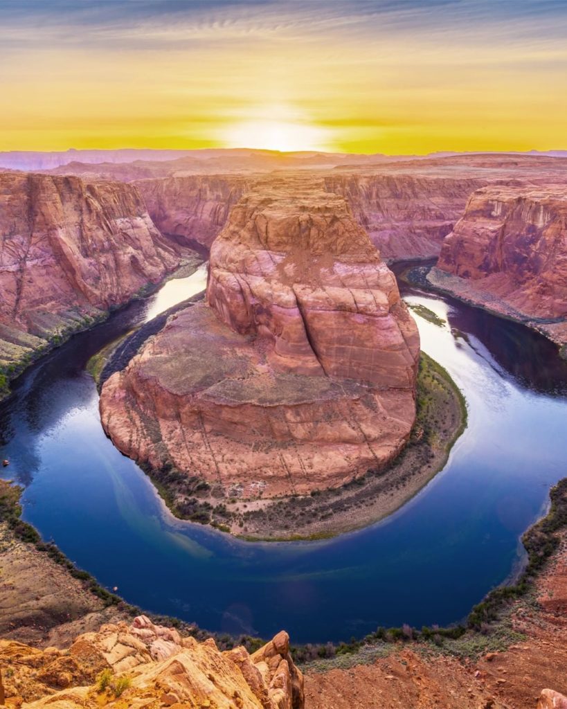 .
The setting sun shines across the rocky terrain at the aptly-named Horseshoe B...