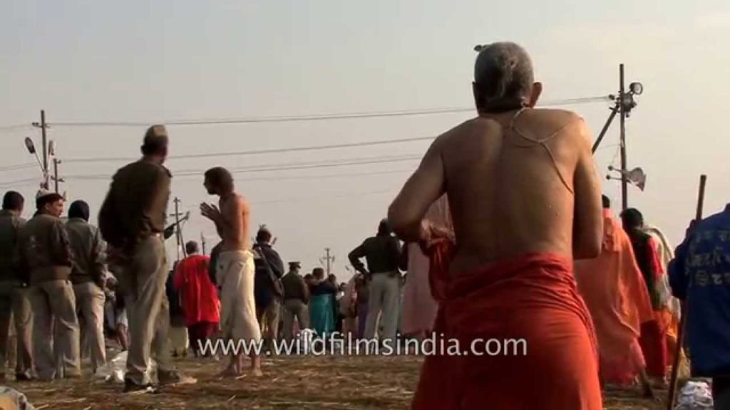 Sadhu changes clothes after snan, Kumbh mela - Allahabad