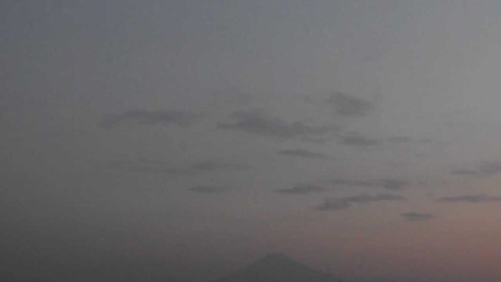 Faint Sunrise Clouds Moving Before Distant Mt. Fuji