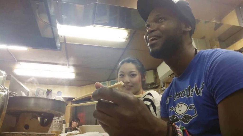 Tourist trying Japanese izakaya food. fukuoka