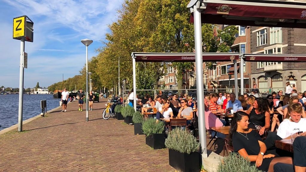 Walking Along the Amstel River in Amsterdam
