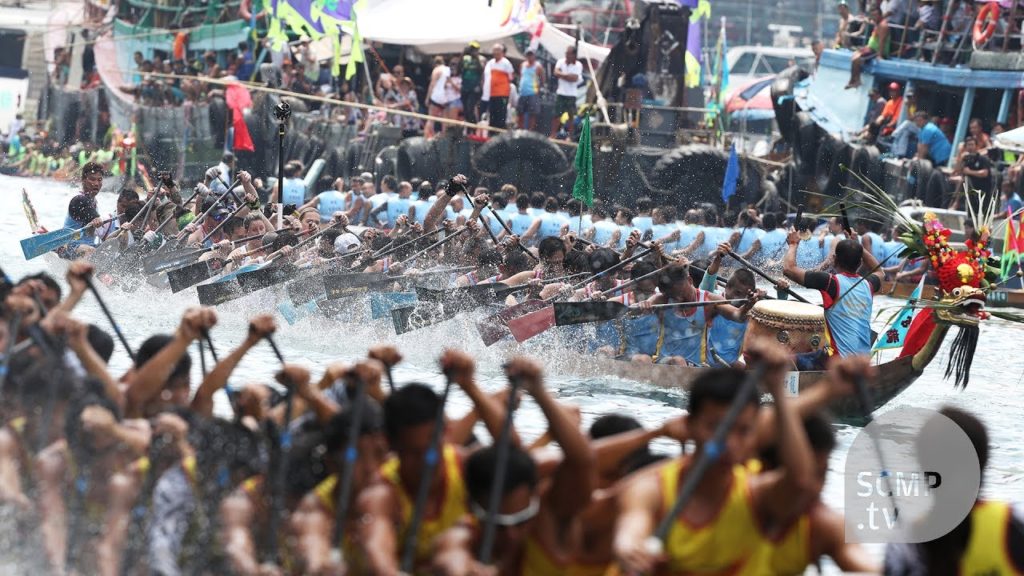 What does paddling a dragon boat during a furious race look like?