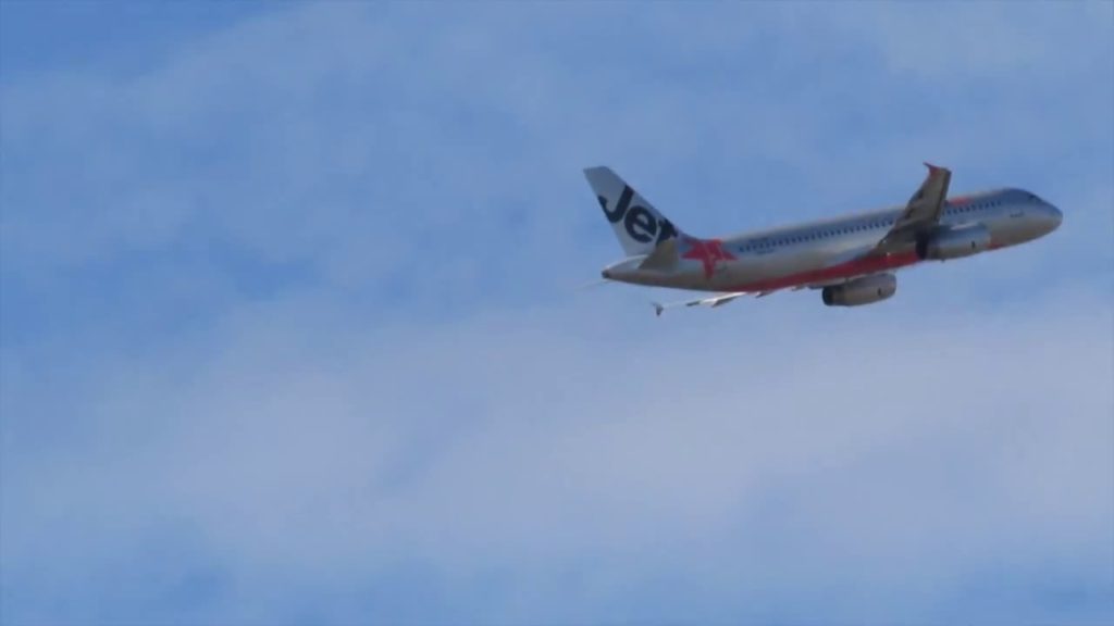 Jetstar Plane take-off Brisbane International Airport