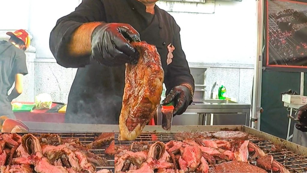 Huge Blocks of Angus, Tenderloin Beef. Meat on Grill American Style. Street Food Fair in Italy