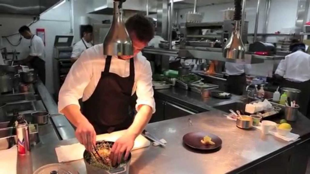 Kirk Westaway prepares a signature dish at Jaan in Singapore