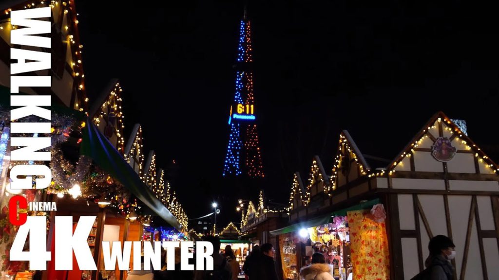 Munich Christmas Market walk from the Sapporo TV Tower shining in blue and red Star Wars colors C4K