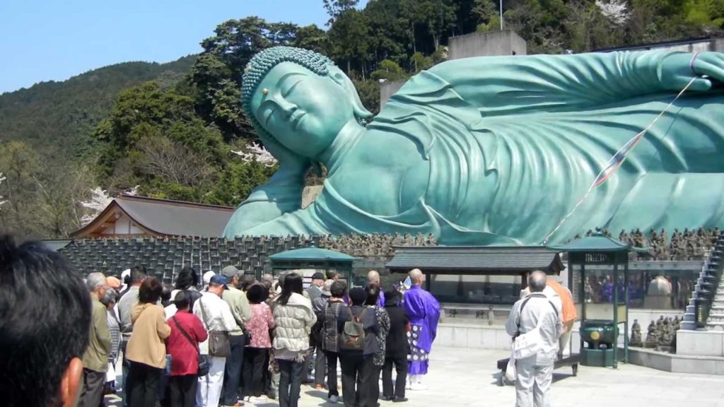 Ceremony at the reclining Buddha statue of Nanzoin, Fukuoka prefecture, Japan