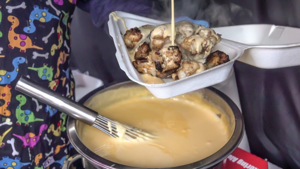 Chicken Wings Drenched in Melted Cheese. London Street Food