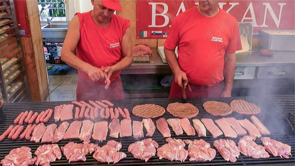 Best of Balkans Street Food. Mixed Meat Roasted on Huge Grills. Street Food Festival seen  in Italy
