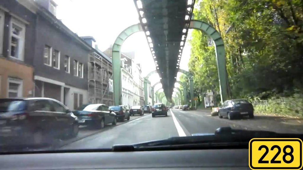 Driving in Wuppertal, Germany  underneath the suspended Monorail Driving in Wuppertal, Germany  underneath the suspended Monorail