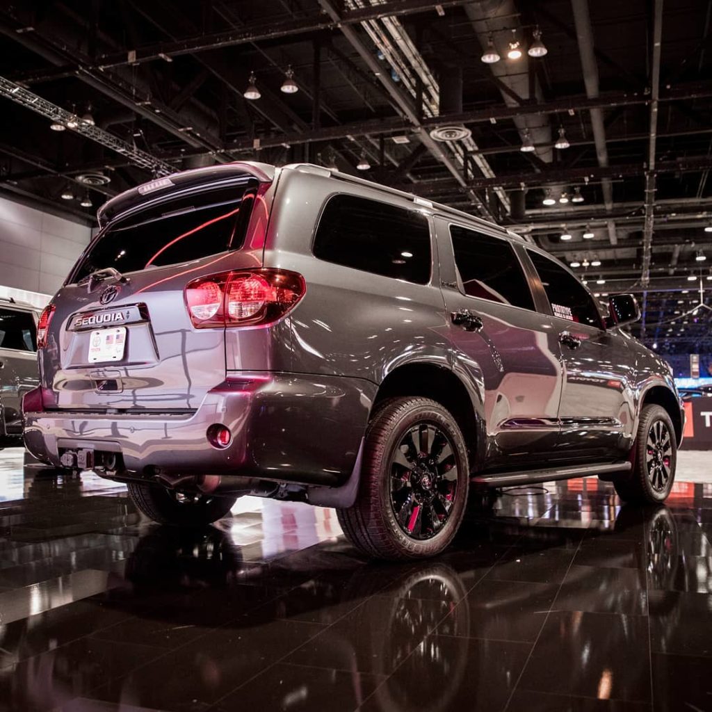 Black painted wheels, a darkened chrome grille, blacked-out exterior badging and...