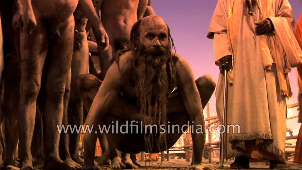 Naked yoga being performed by Naga Sadhu in Kumbh Mela