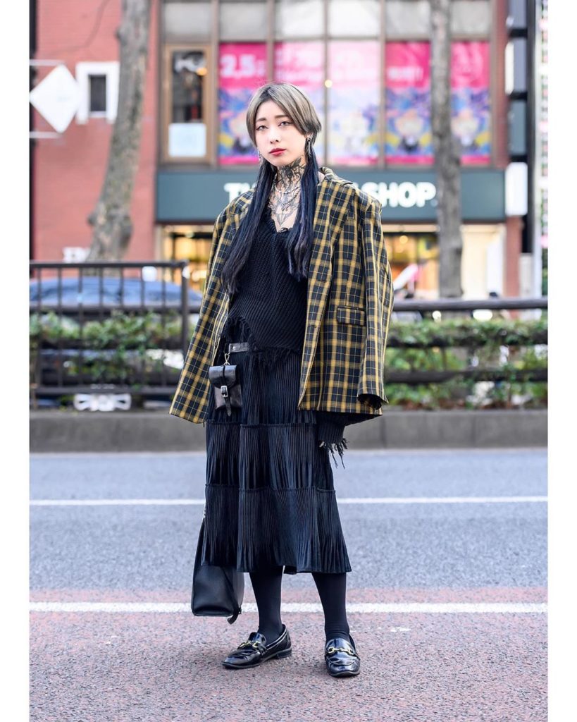 21-year-old Japanese tattoo model Chihiro (@chim_8_) on the street in Harajuku t...