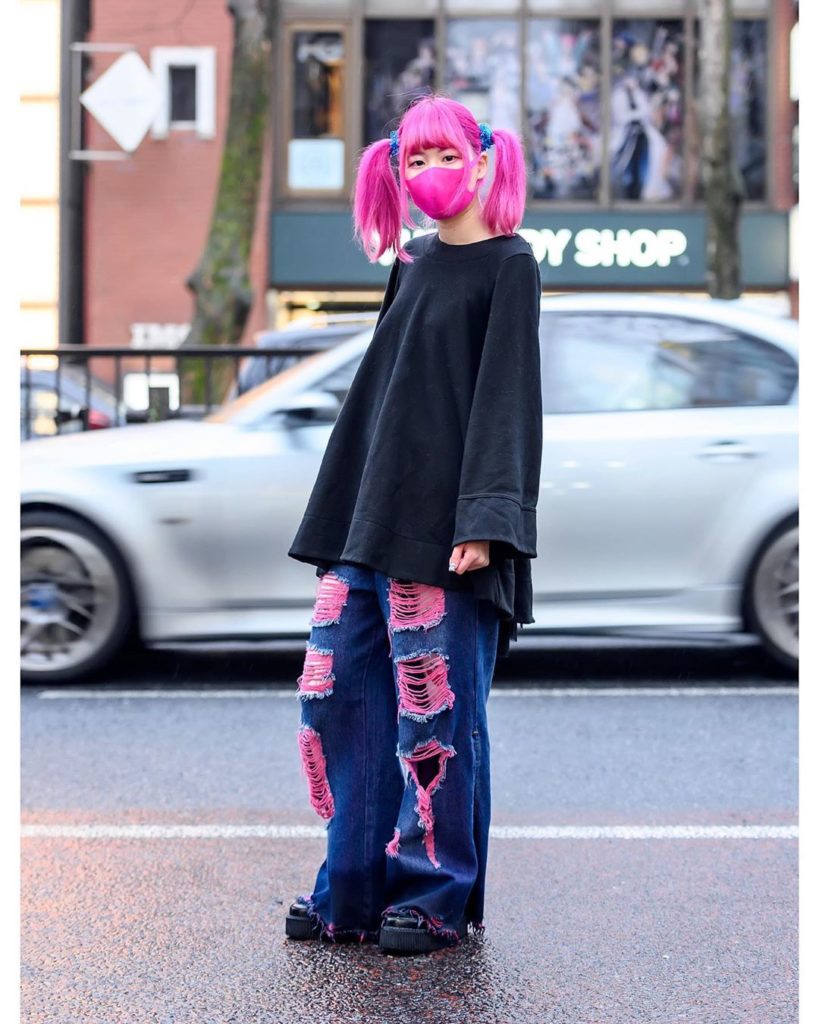 Japanese hair stylist Paso (@sakupaso49) on the street in Harajuku with pink twi...