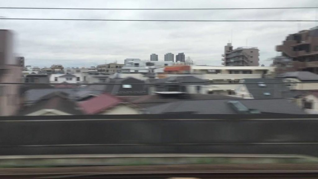 View on a gloomy day from a Shinkansen window. Shingawa, Tokyo to Yokohama.