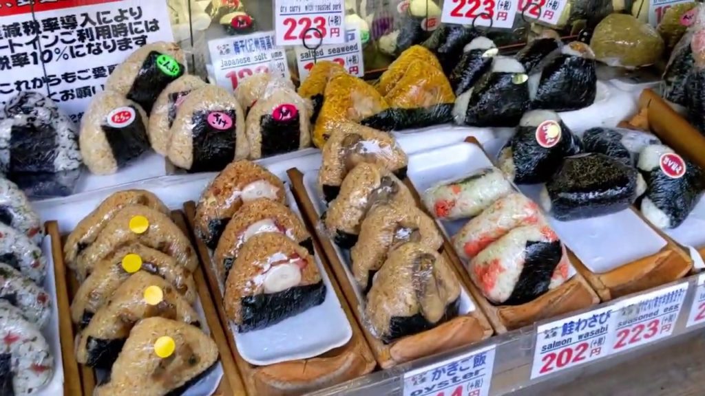 Japanese Street Food – Onigiri (Rice ball) "Marutoyo" in Tsukiji Market Tokyo Japan Japanese Street Food - Onigiri (Rice ball) "Marutoyo" in Tsukiji Market Tokyo Japan