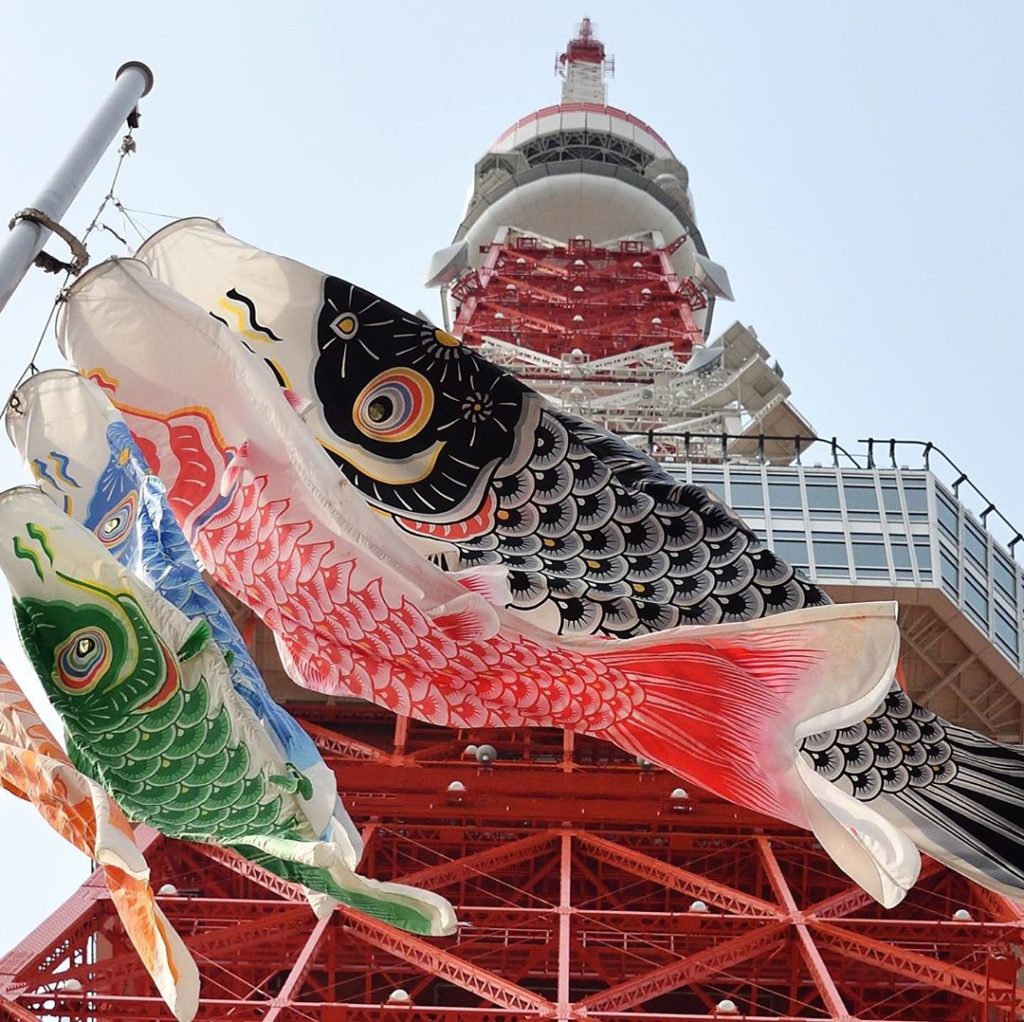 "Koinobori" carp streamers are hung in front of Tokyo Tower. The windsocks celeb...
