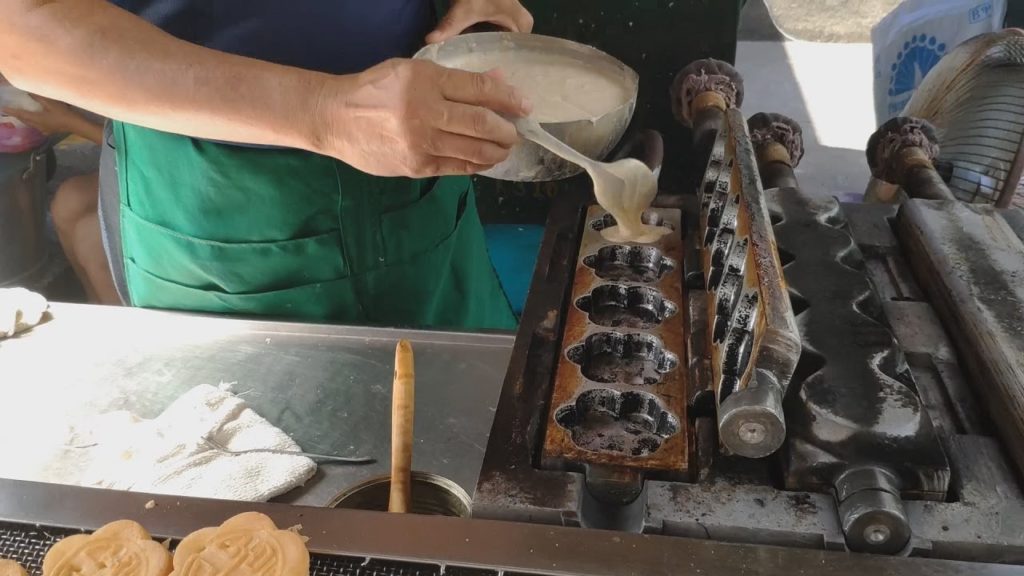 Egg shaped pancakes—Taiwanese street food.Hsinchu City God Temple Egg shaped pancakes—Taiwanese street food.Hsinchu City God Temple
