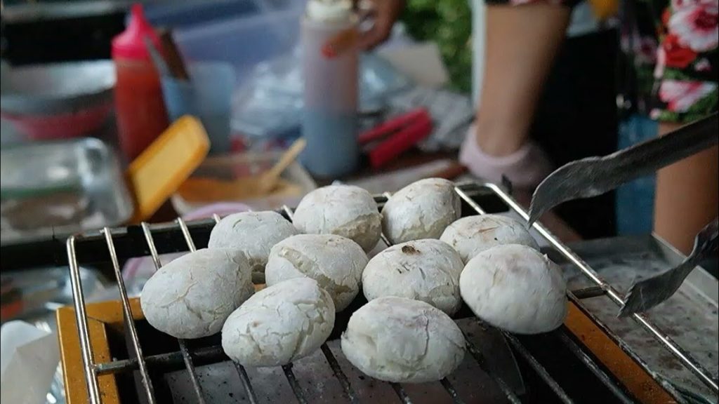 Indonesian street food - ( PEMPEK ) Baked and fried round fish cakes