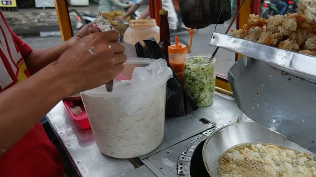Indonesian Street food - ( Batagor ) Fried tofu meatballs with peanut sauce