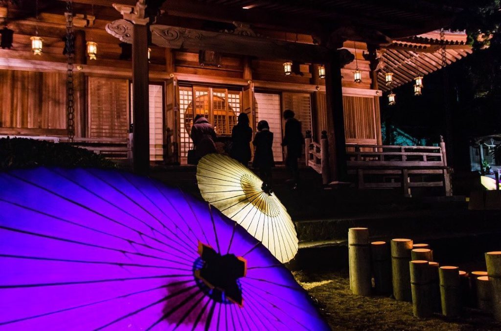 Paper umbrellas illuminated with candles light up the streets of Yamaga in Kumam...