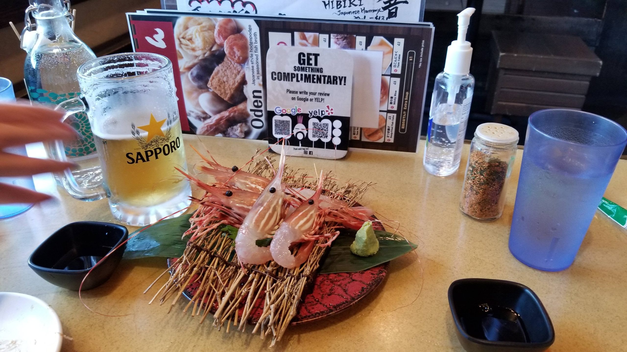 Spot prawn sashimi and ice cold sapporo Alo Japan