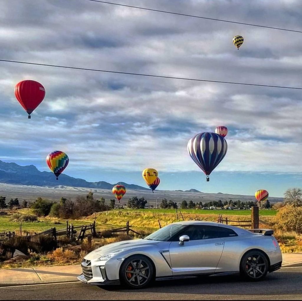 Anyone down for a road trip? Views of mountain peaks and floating hot air balloo...