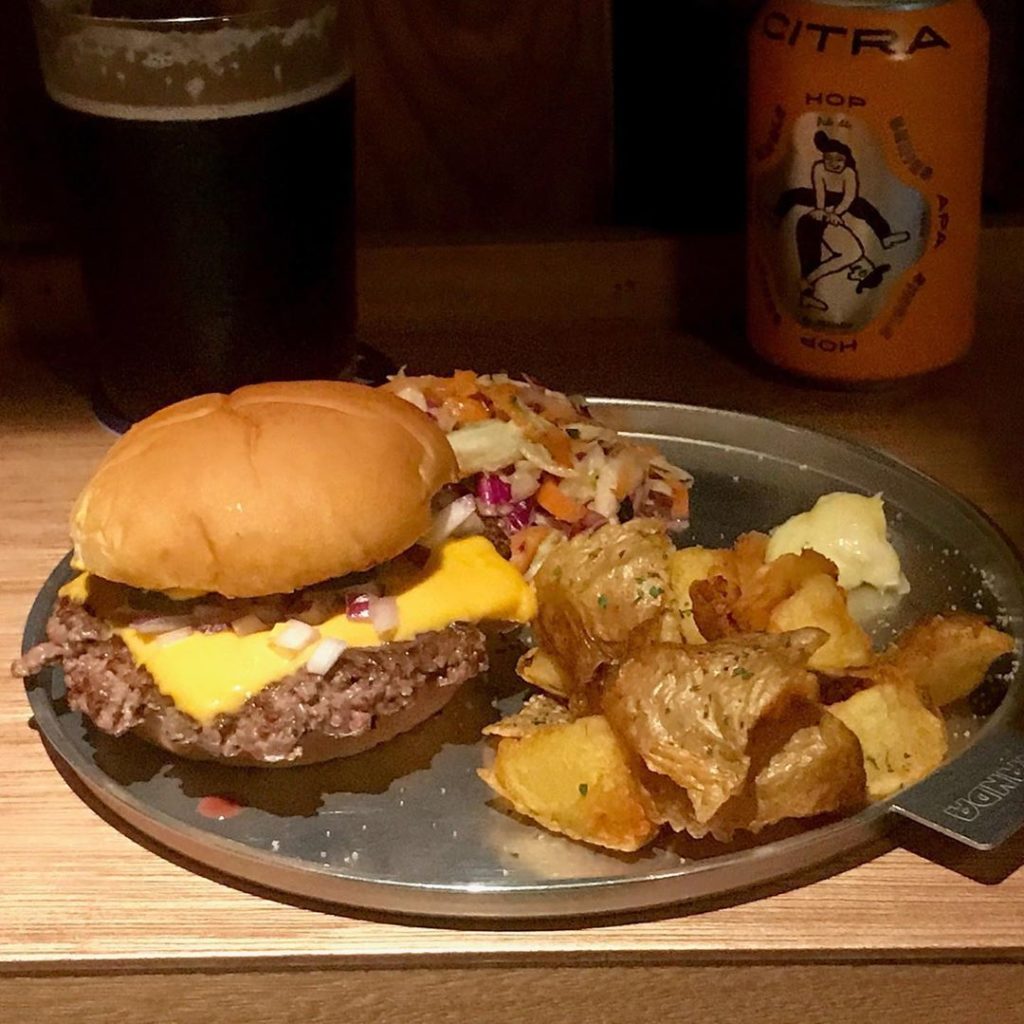 Beer and burgers; burgers with beer. Either way, that’s a killer combination, es...