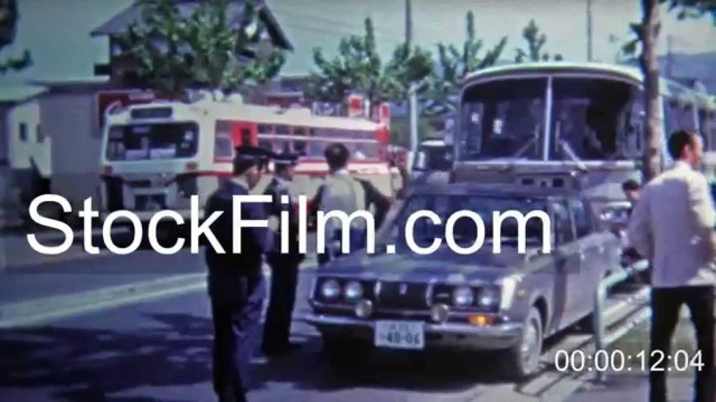 1972: Japanese police capture criminals in car accident. Okayama, JAPAN