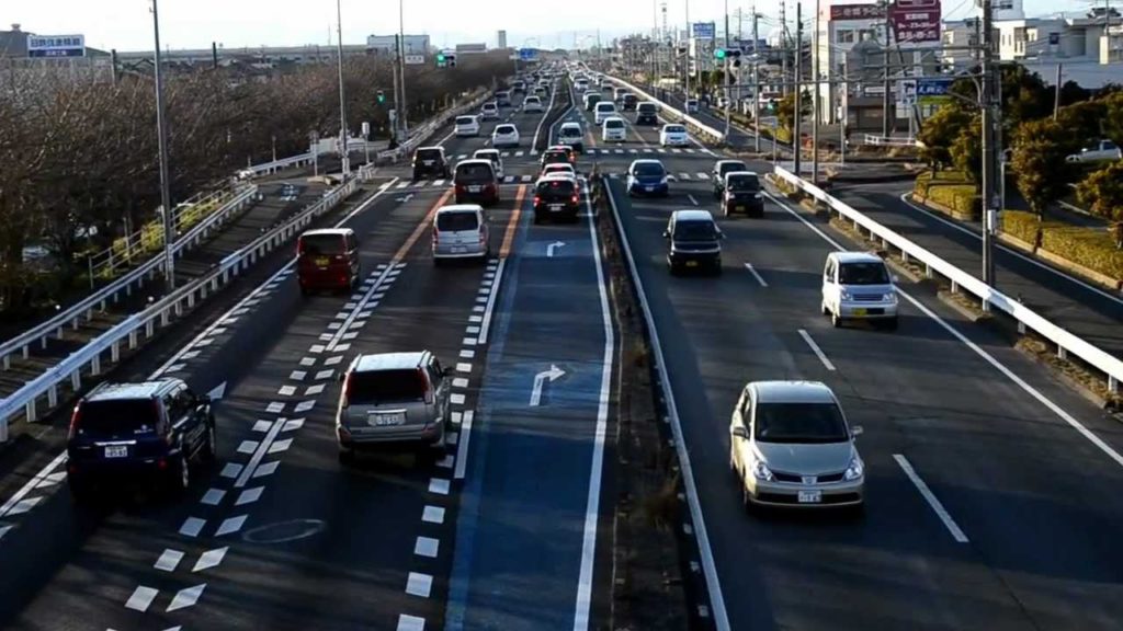 JAPAN .. cherry blossoms tree lined highway.