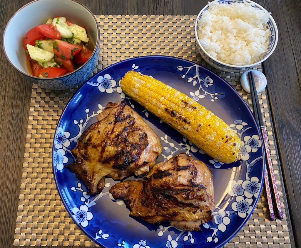 Marinated some chicken thighs in soy sauce, orange juice, ginger and garlic, then threw them on the grill and had them with tomato and cucumber salad to which I added soy sauce, sushi vinegar, shiso and green onion.