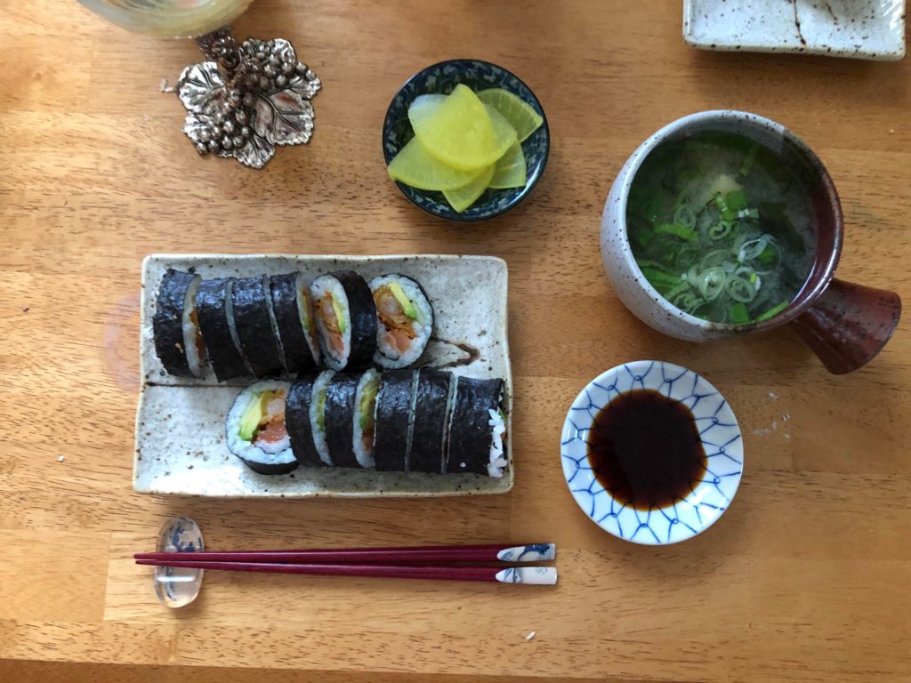 Japanese feast: salmon tempura sushi rolls, miso soup, pickled radish, sunomono salad (not pictured) 😋