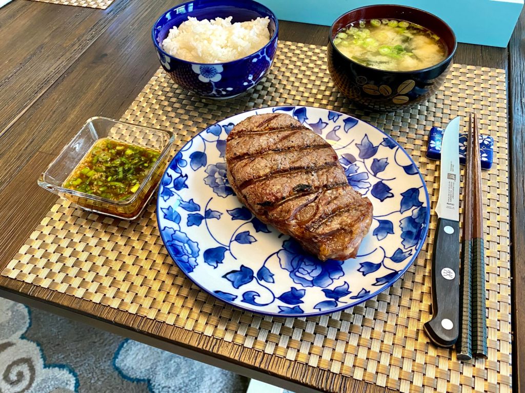 Steak with ponzu, ginger and green onion dipping sauce.