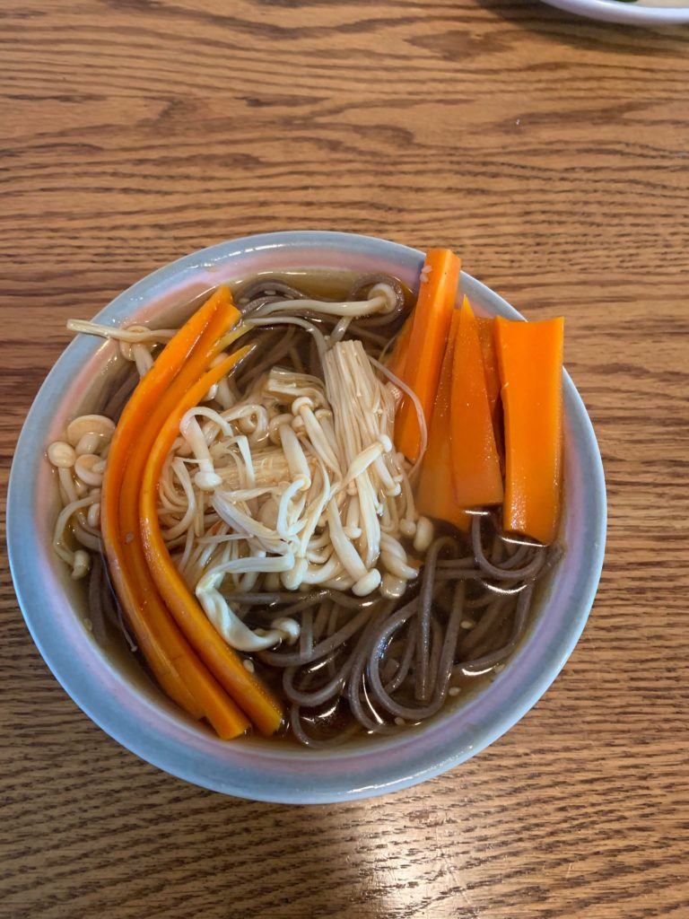 Made my vegan friend and I my first vegan fully plant meal. Soba bowl with vegetable broth and enoki mushrooms with carrots. Not shown are roasted squash. Very happy with it
