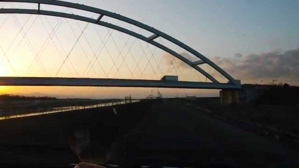 Sunset color bridge. Omuta River estuary