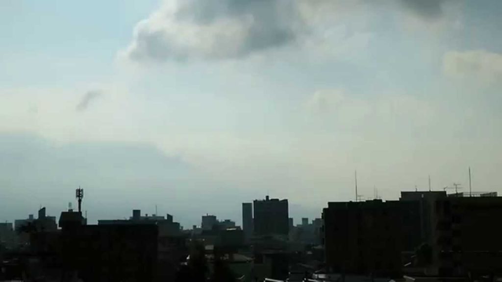 Volcano Sakurajima with a Silhouette of Kagoshima City (2015/07/30 07:55) Wind NW'ly, Sunny